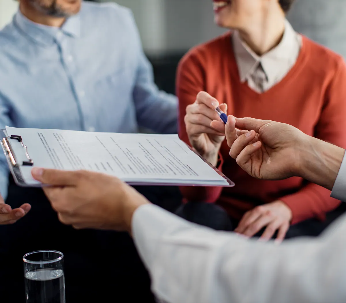 TB advisor reviewing a policy document with clients